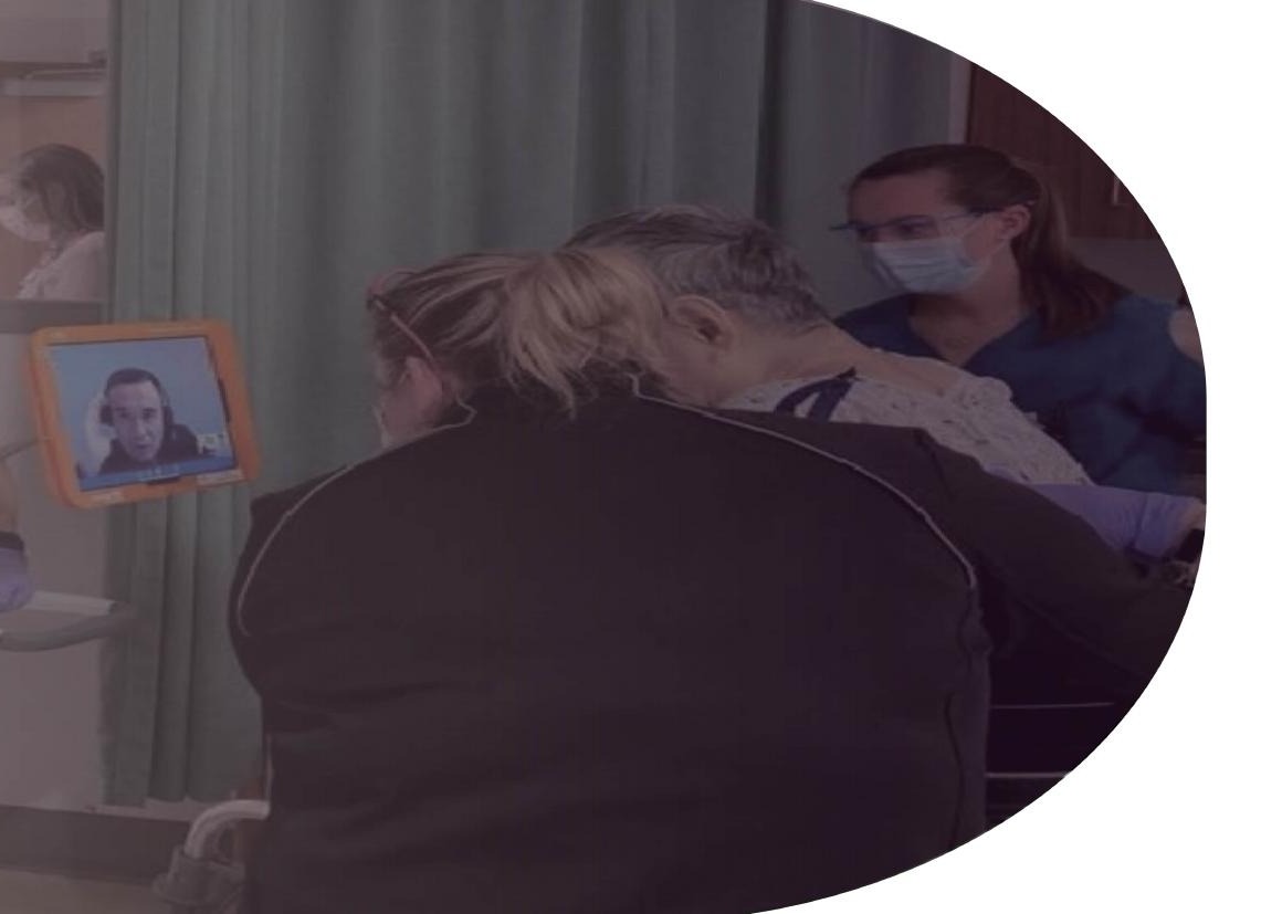 A deaf patient using remote interpretation during a hospital visit