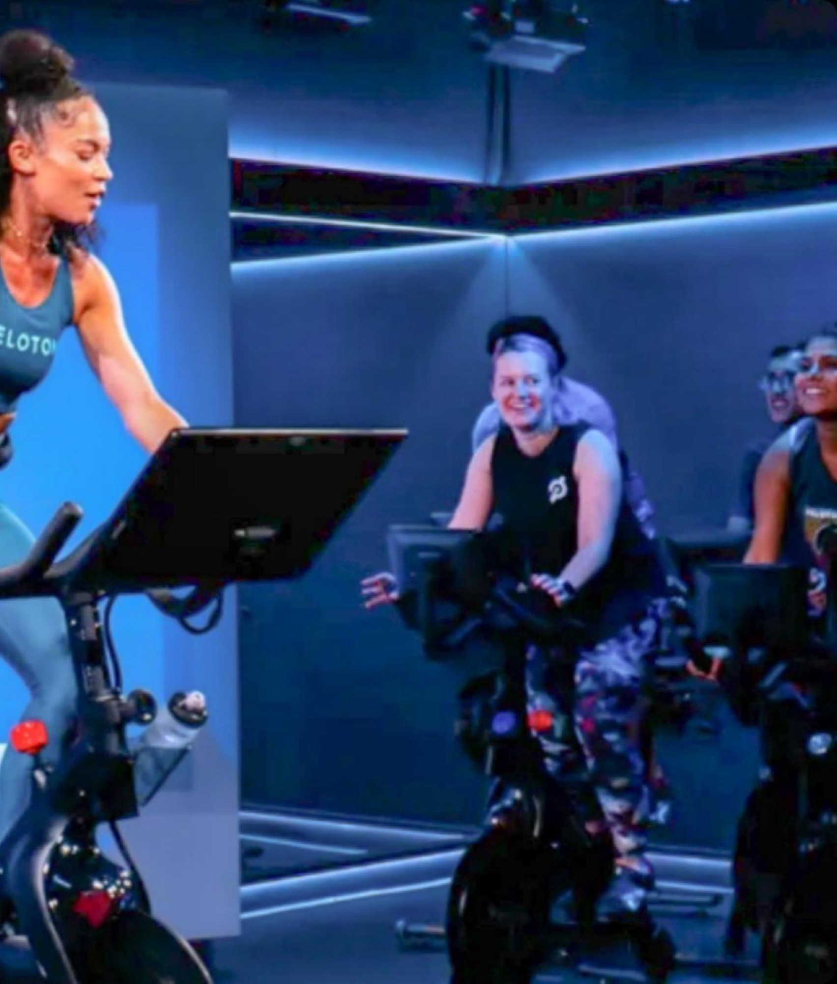 Peloton instructor leading a studio cycling class